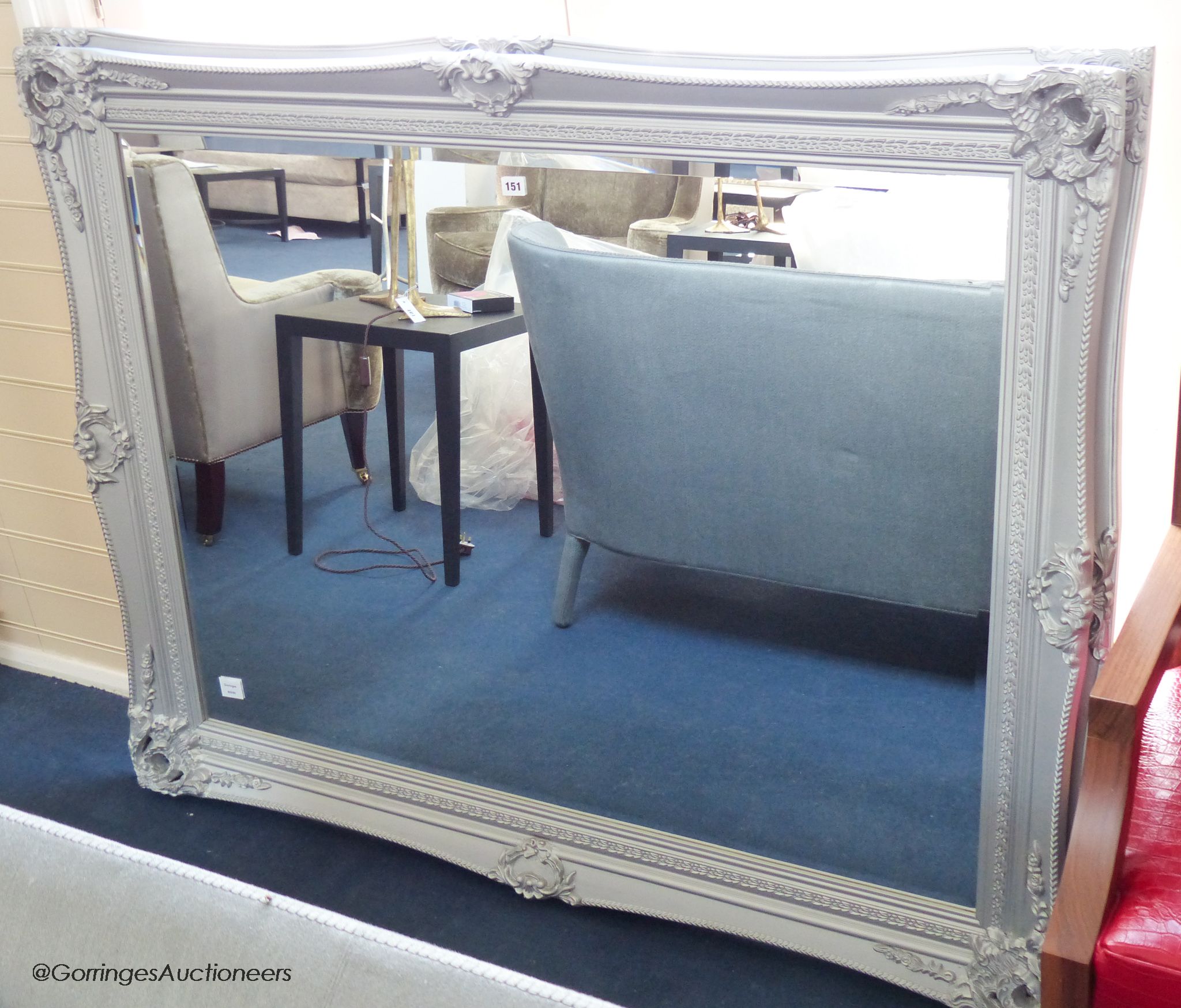 A large silver-grey painted mirror, 117 cm high, 147.5 m wide